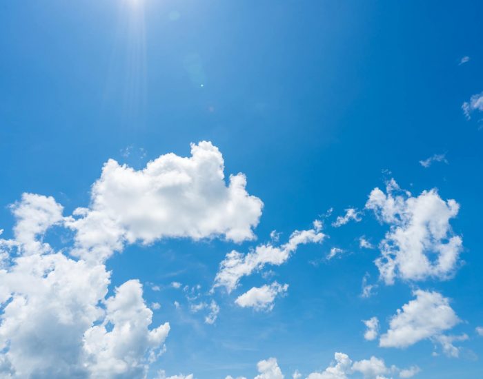 Blue sky and white clouds with sunlight on sunny day. World ozon Blue sky and white clouds with sunlight on sunny day. World ozone day concept. Blue sky background for international day for the preservation of the ozone layer. Cloudscape. Hot weather in summer.